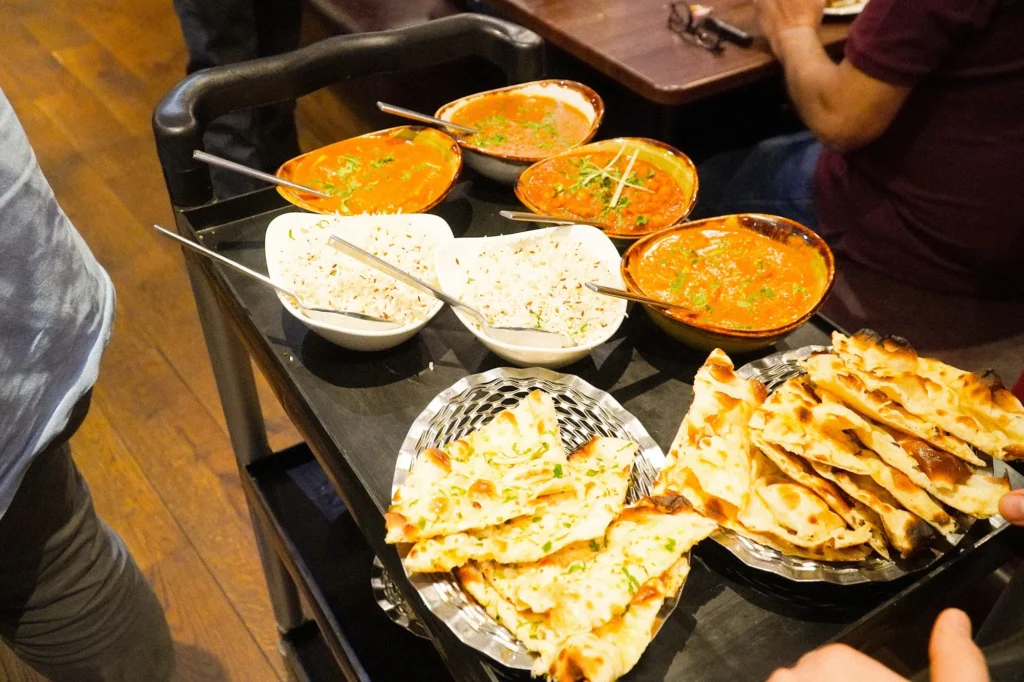 Curries, rice and naan being served at Dawat Bar and Kitchen
