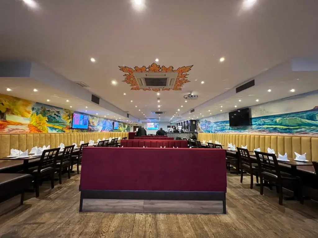 Dining room with painted mural at Dawat Bar and Kitchen, Queensbury