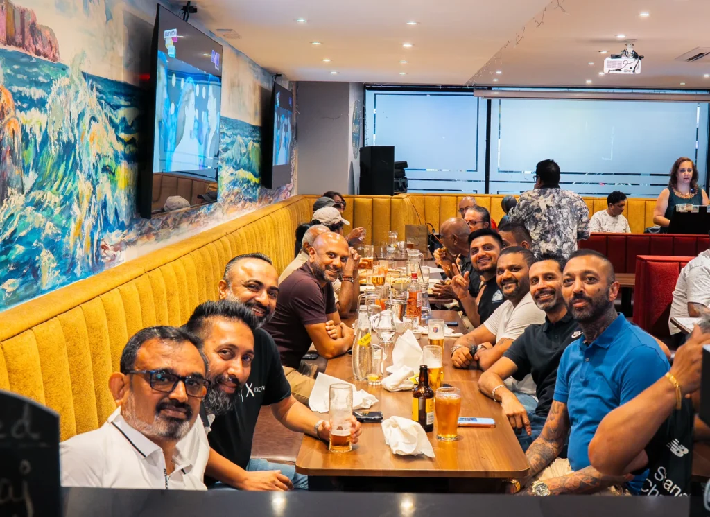 Large group at a long table for a party at Dawat Bar and Kitchen