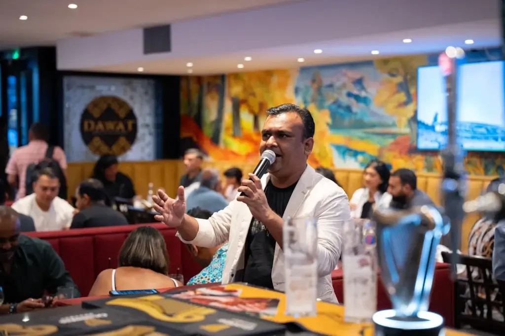 Singer working the room on a live music night at Dawat Bar and Kitchen