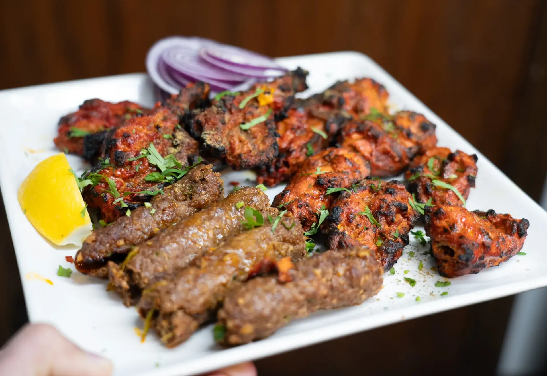 Mix Grill platter with seekh kebab, lamb chops, chicken tikka and wings at Dawat Bar and Kitchen