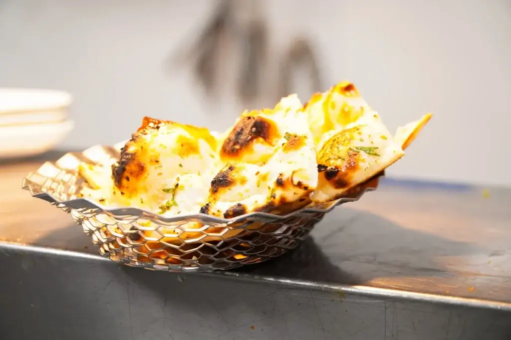 Basket of fresh naan from the tandoor at Dawat Bar and Kitchen