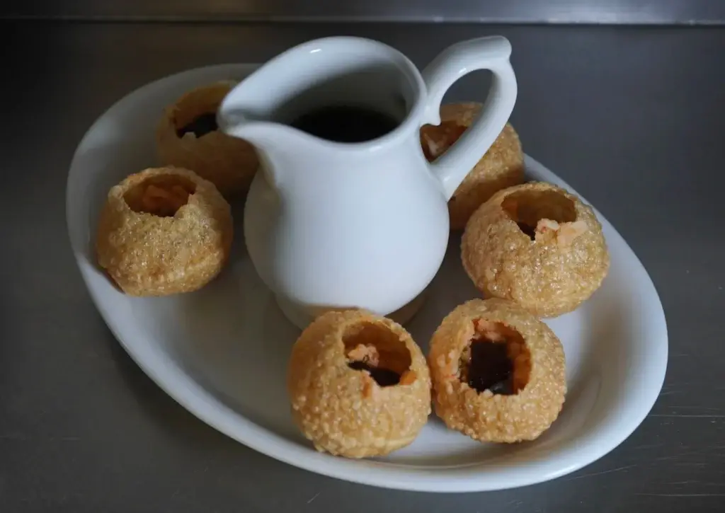 Panipuri with a jug of spiced water at Dawat Bar and Kitchen