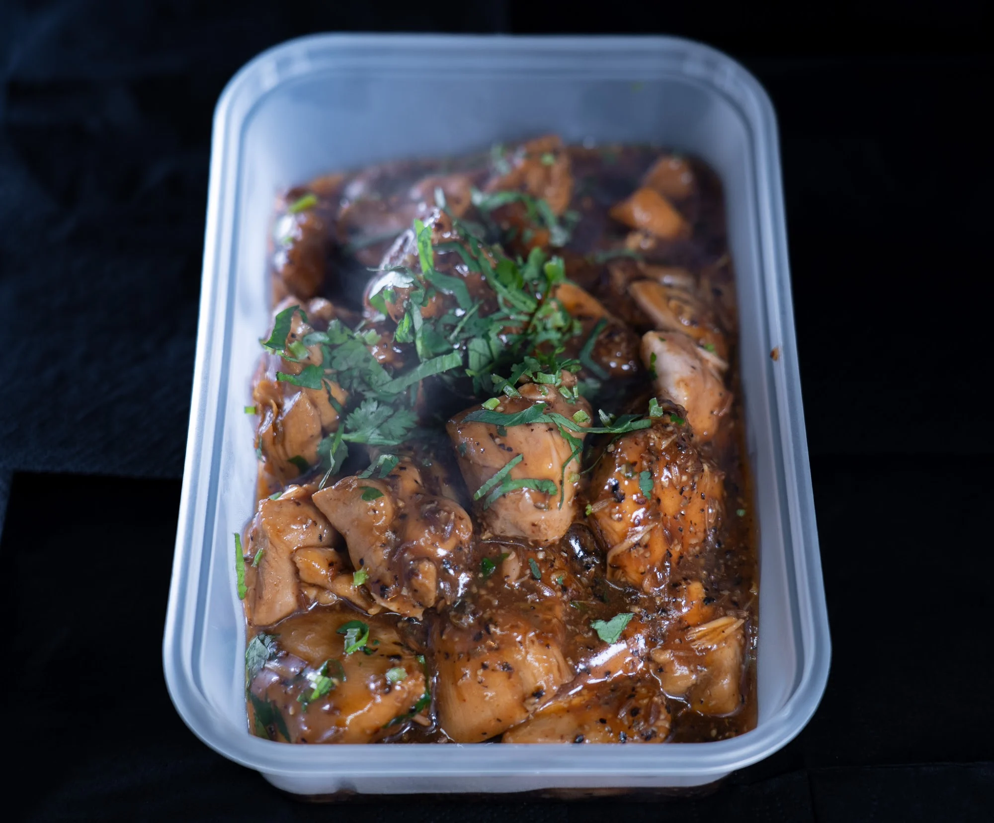 Curry in a takeaway box from Dawat Bar and Kitchen